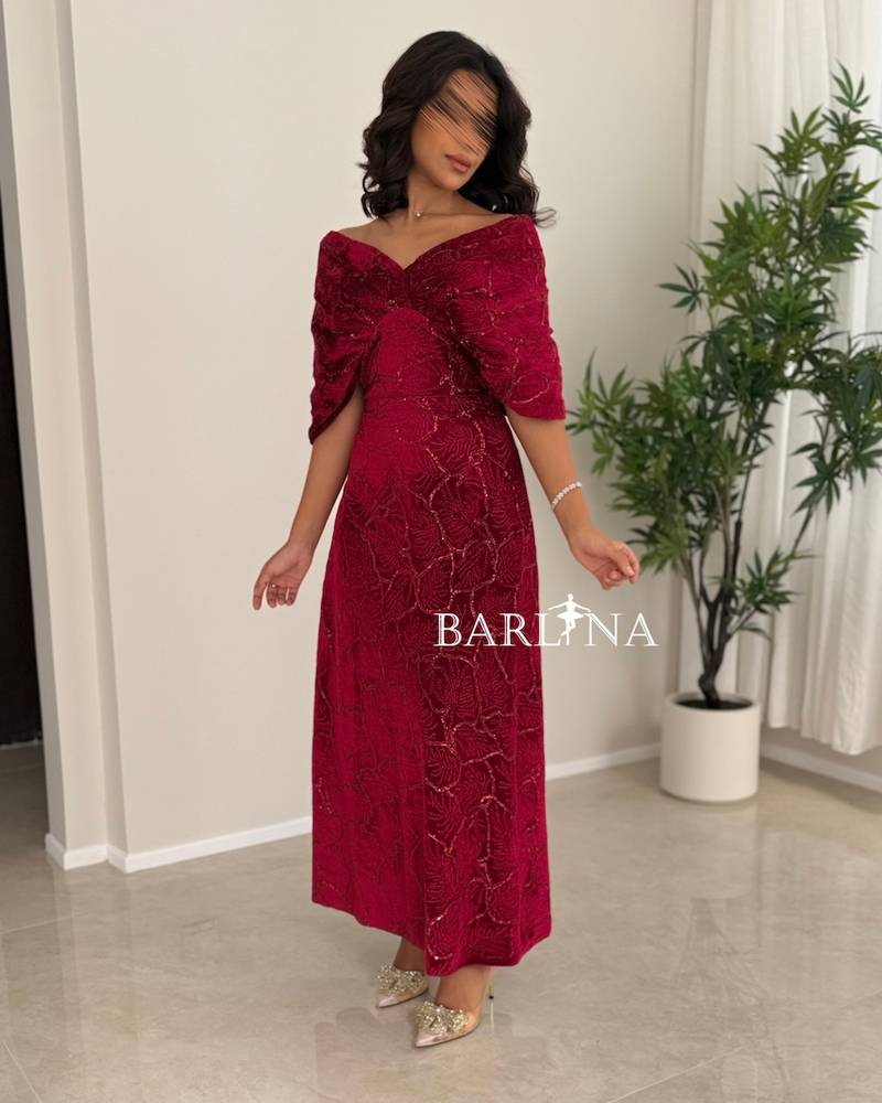 A red dress with an elegant design and luxurious embroidery.
