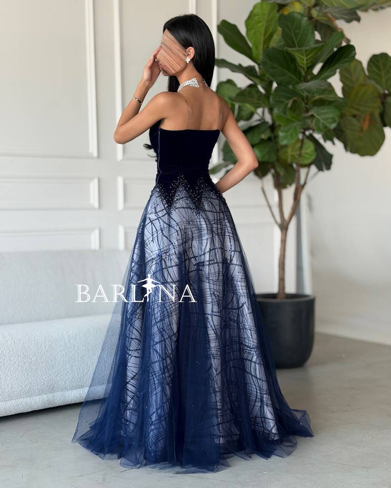 A woven dress with embroidery and shimmering gradients