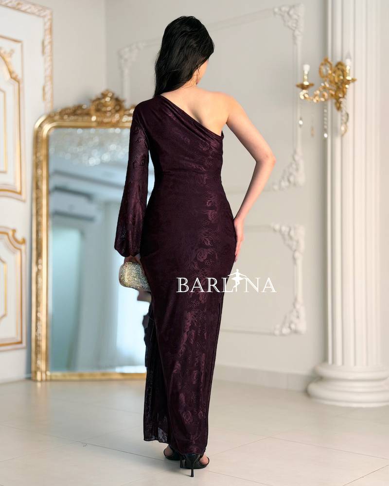 A soft, fitted dress adorned with elegant metallic details.