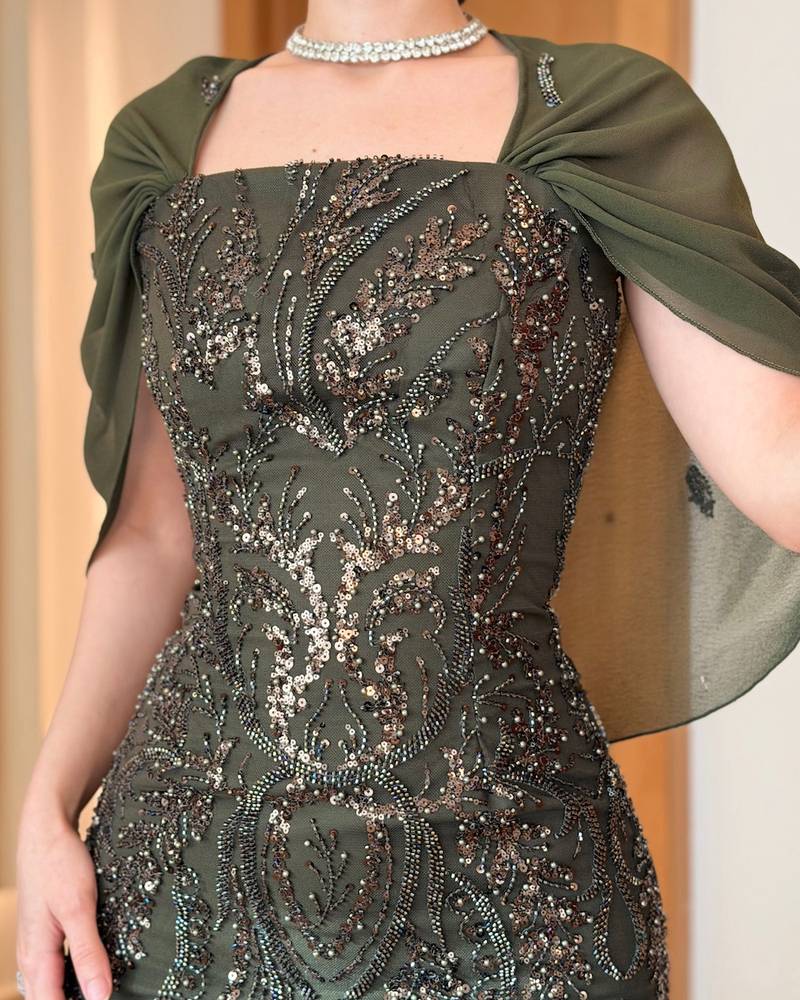 Dark olive evening dress with a sheer cape