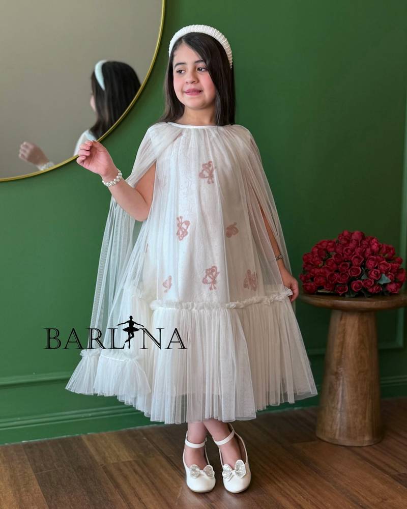 white girl's dress with wide tulle sleeves