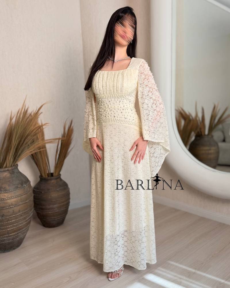 Beige lace dress with delicate pearl embroidery