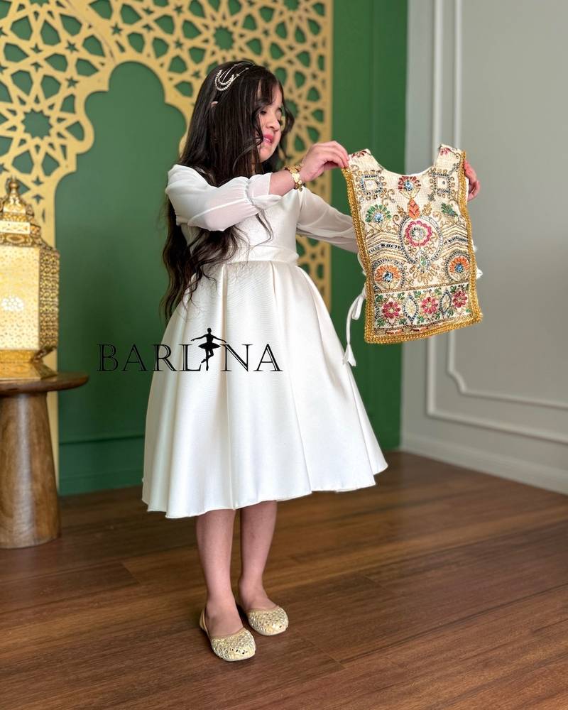 White girl's dress with a fully embroidered bodice