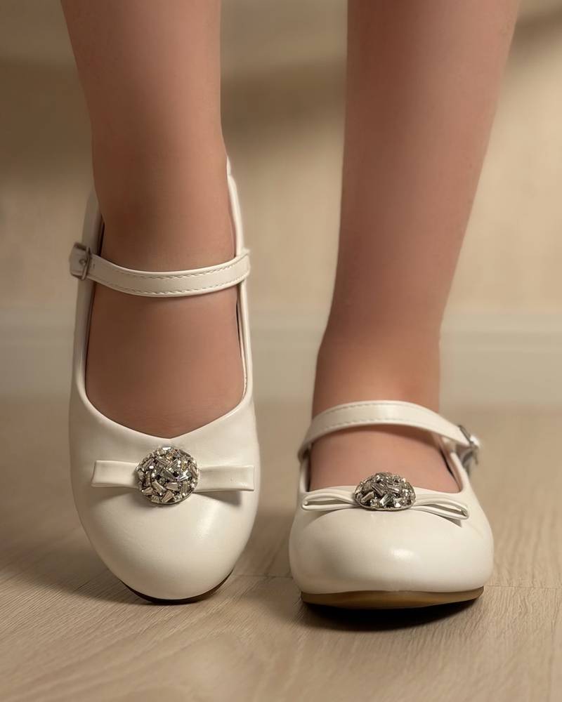 Classic girls' shoes with a bow and crystal
