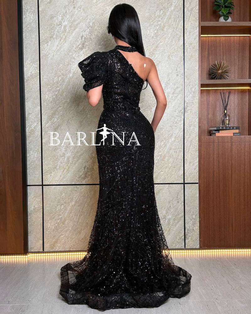 Black one-shoulder shiny dress with front slit
