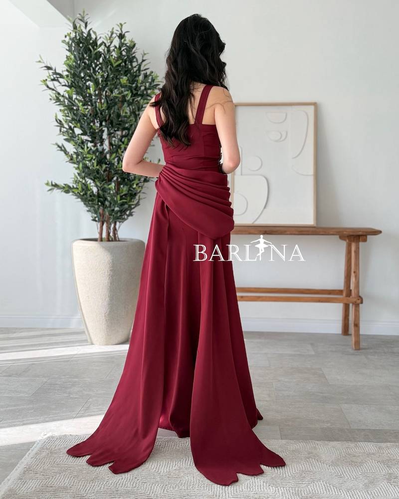 Long burgundy dress decorated with sparkling beads