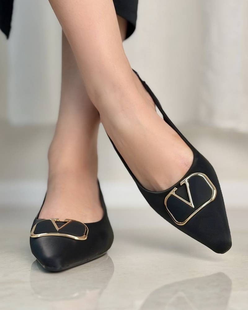 Women's shoes with a small heel and metal detail