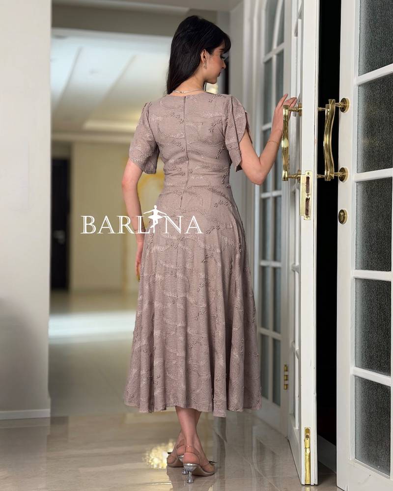 A soft V-neck dress adorned with roses