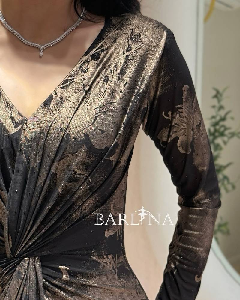 A soft black dress with gold rose patterns
