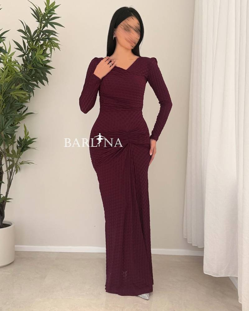 A soft burgundy dress with elegant details