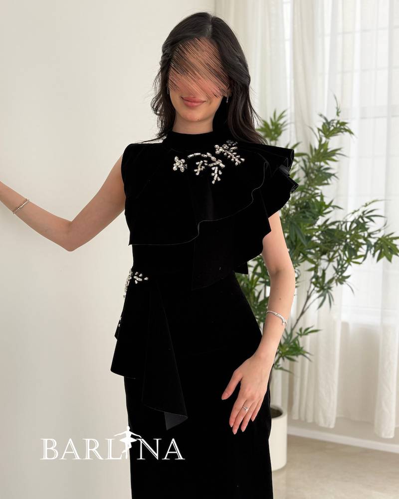 Black velvet dress with embroidered side details