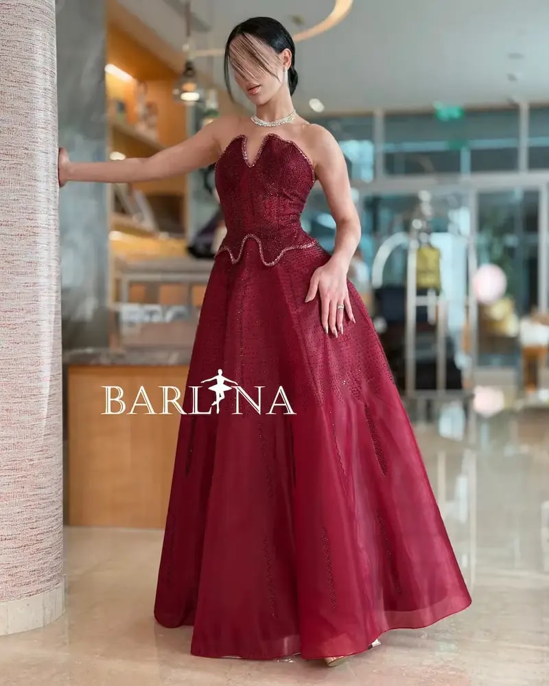 Burgundy puffy evening dress with a corset design