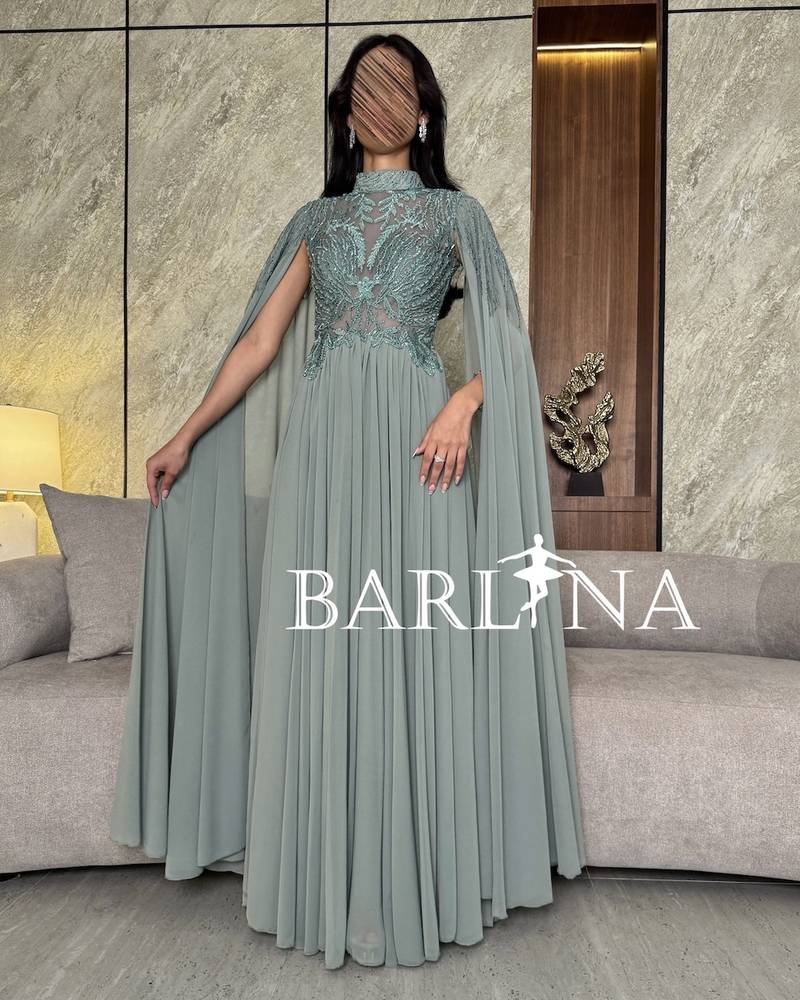 Tiffany dress with royal details and a long cape
