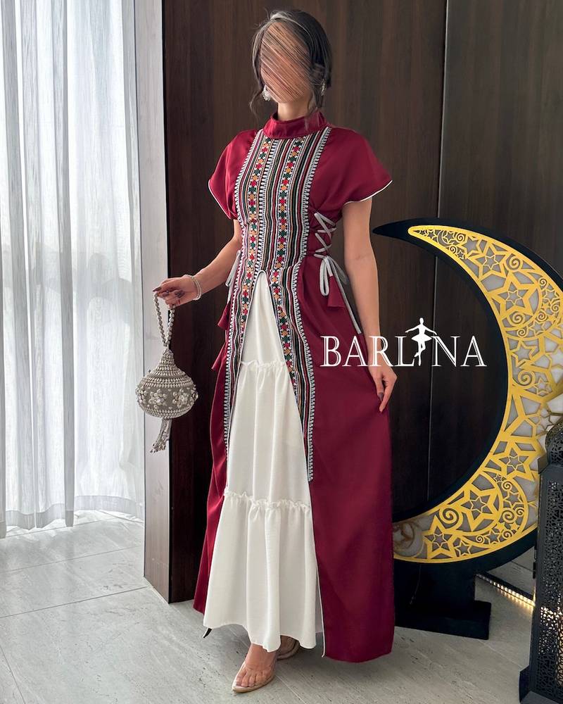 Maroon jalabiya decorated with Sadu patterns