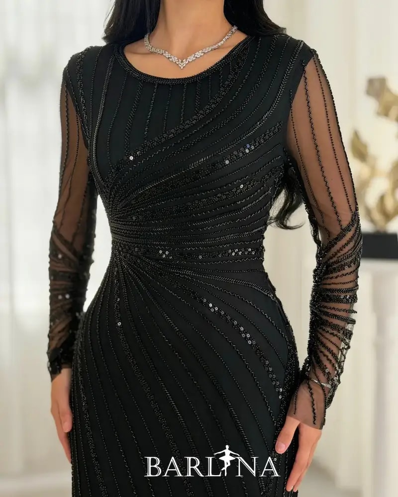 Elegant evening dress adorned with shimmering embroidery lines