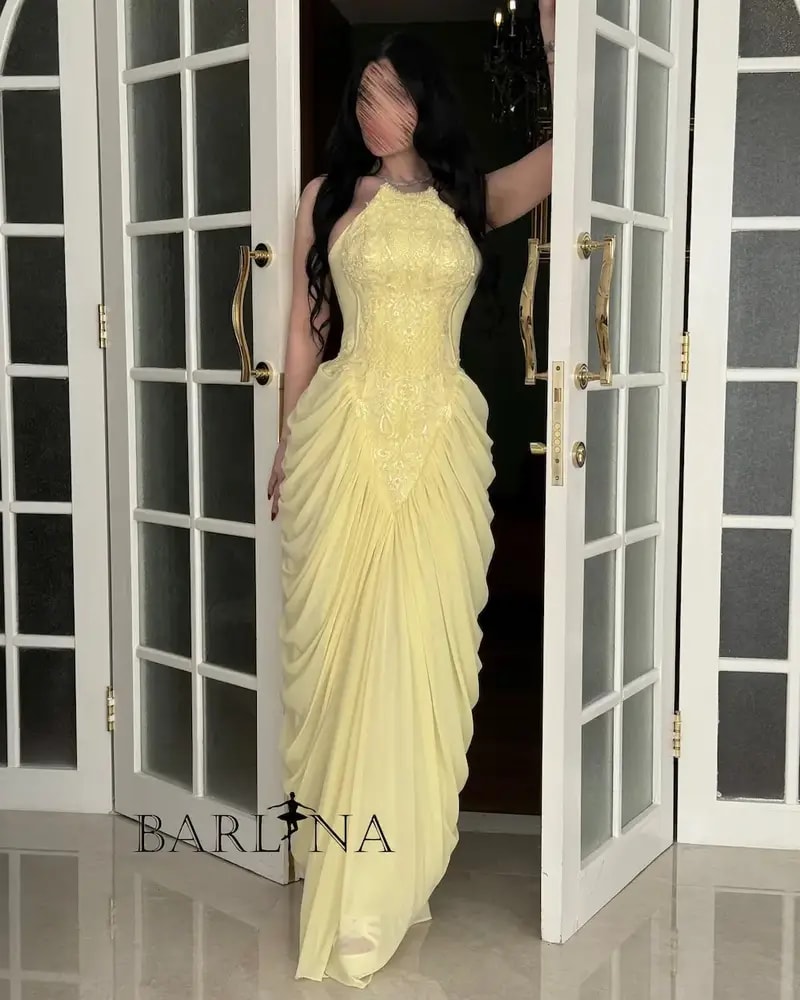 Yellow dress with delicate embroidery and ruffle details