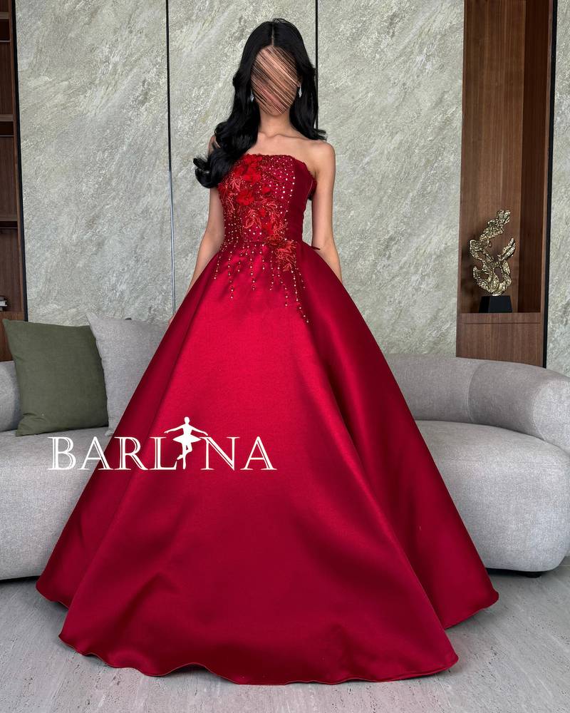 Royal red dress with luxurious embroidery on the chest