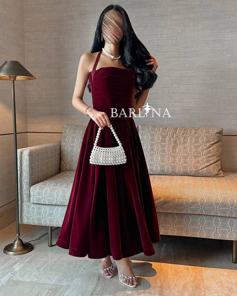 Soft burgundy velvet dress with a tie around the neck