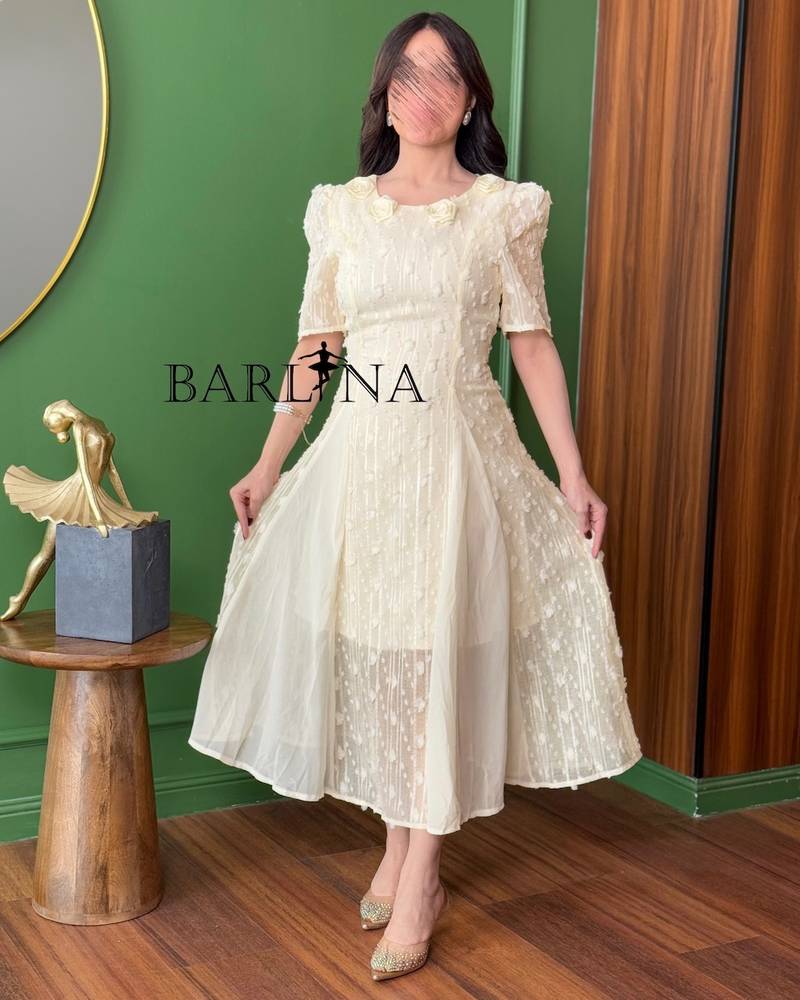 Soft beige dress embroidered with roses