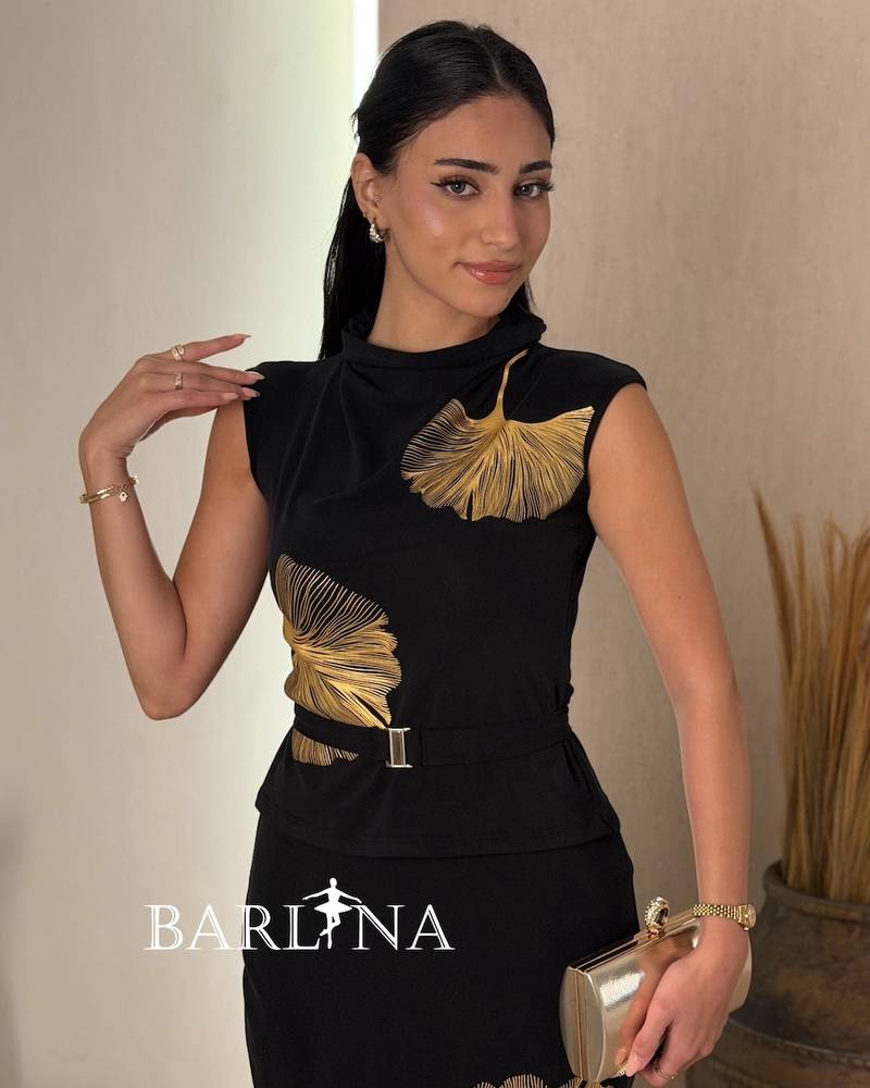 Black set decorated with a gold leaf pattern