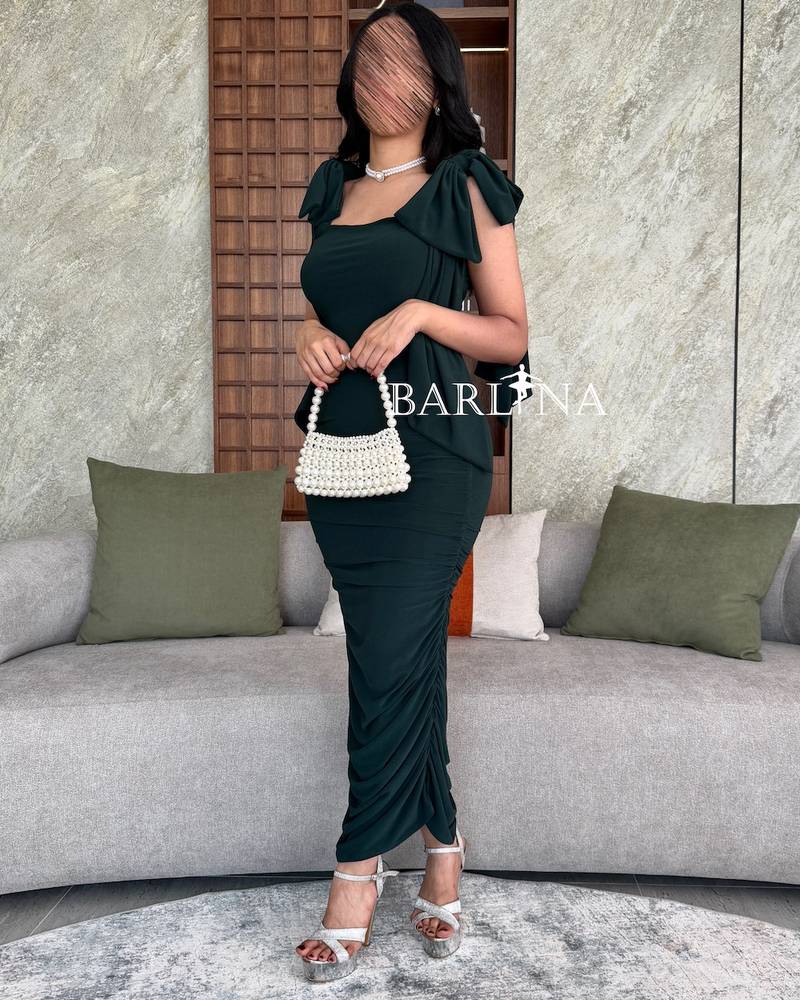 Dark green dress with bow on the shoulders