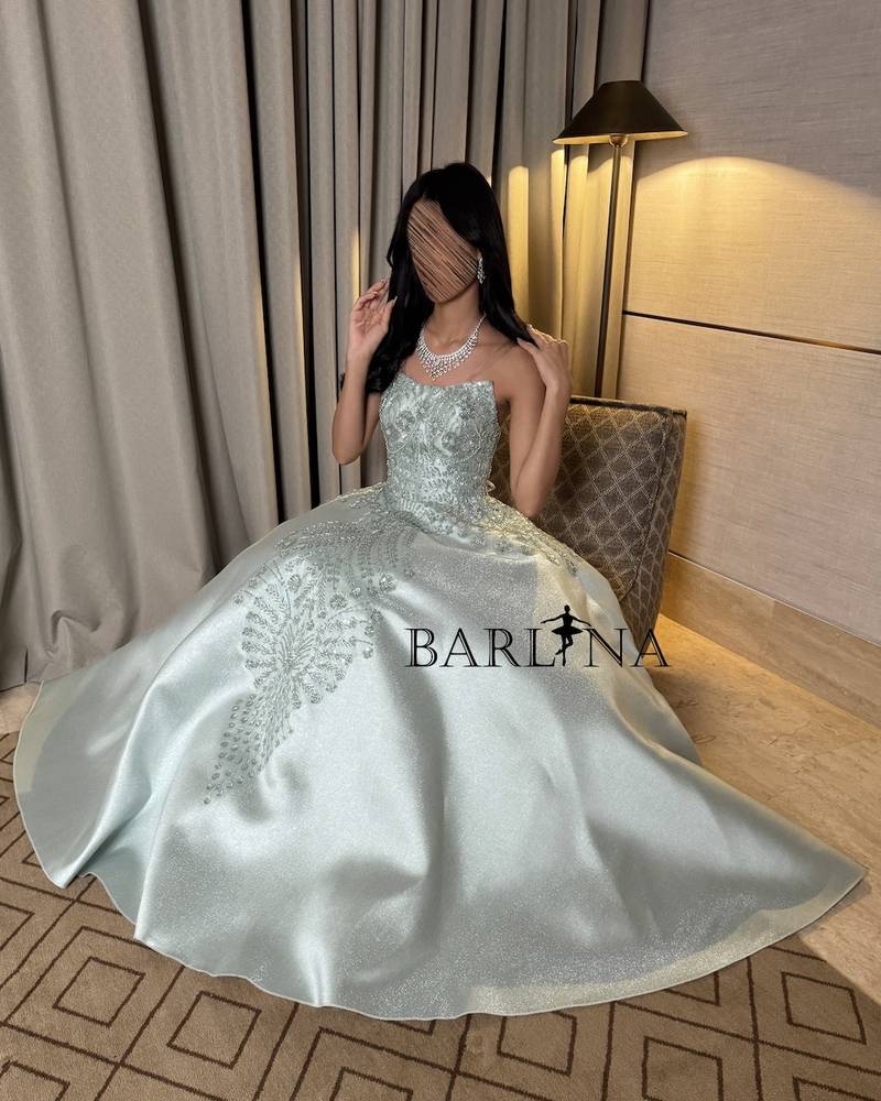 Light green dress with elaborate floral motifs