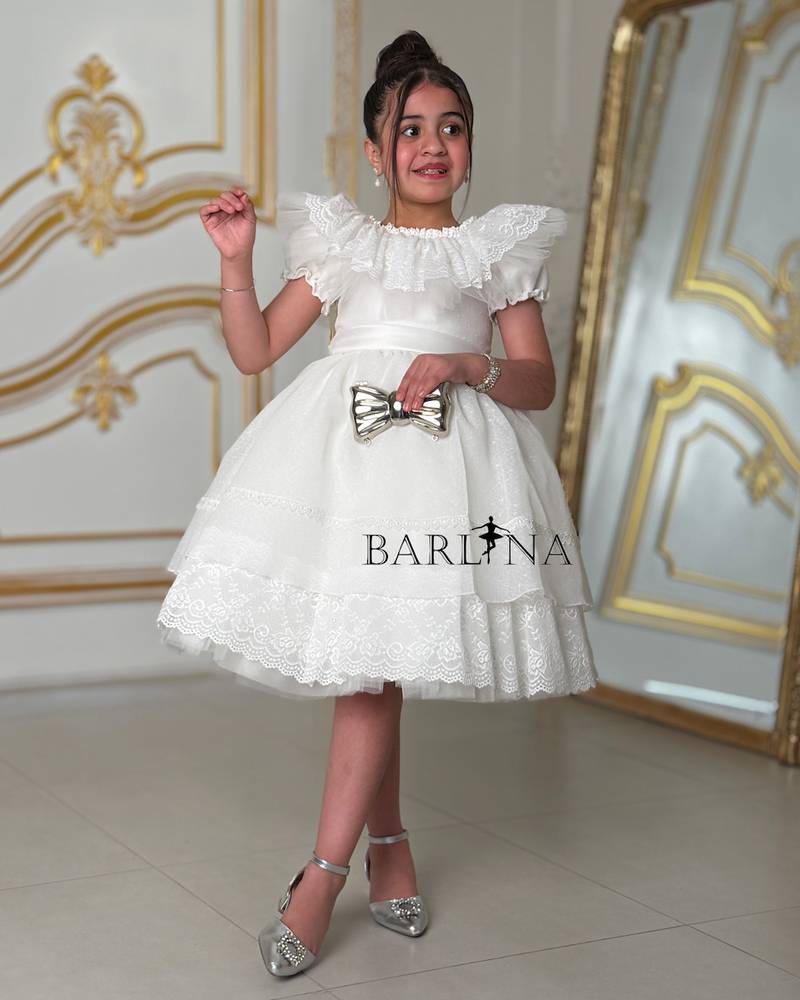 white fluffy girl's dress with lace details