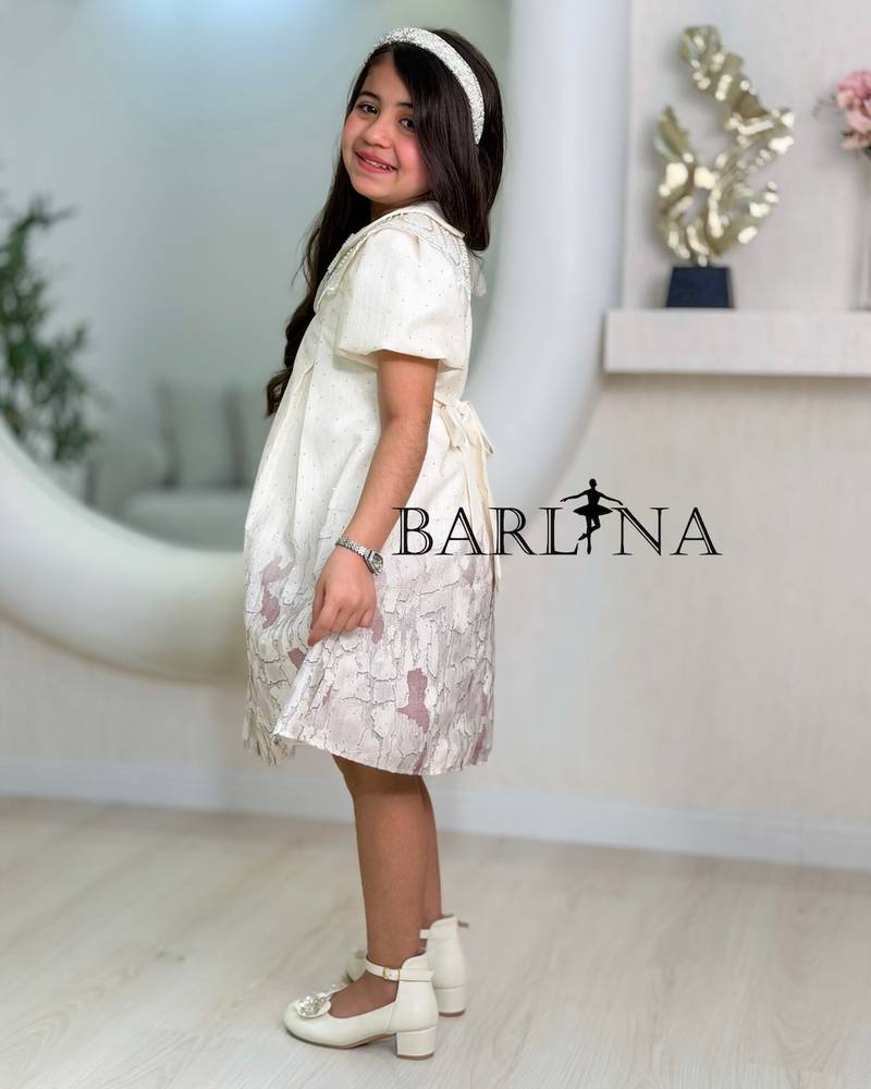 A short girl's dress decorated with delicate embroidery