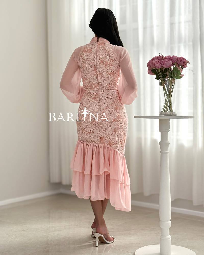 A soft pink dress with elegant embroidery