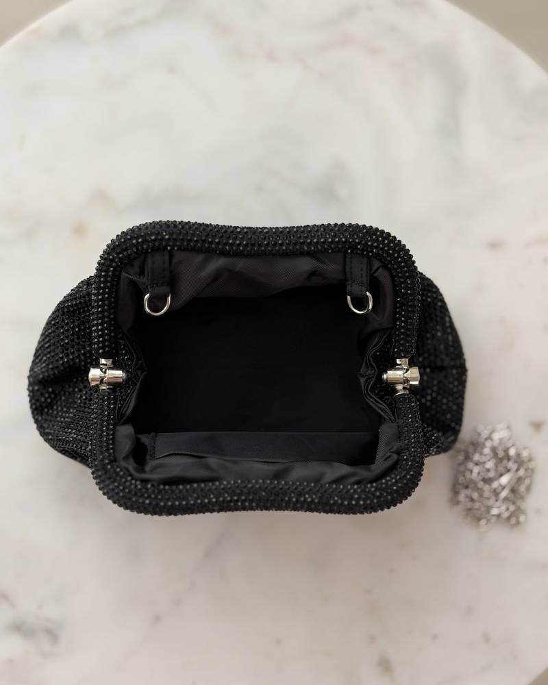 Elegant black handbag studded with rhinestones