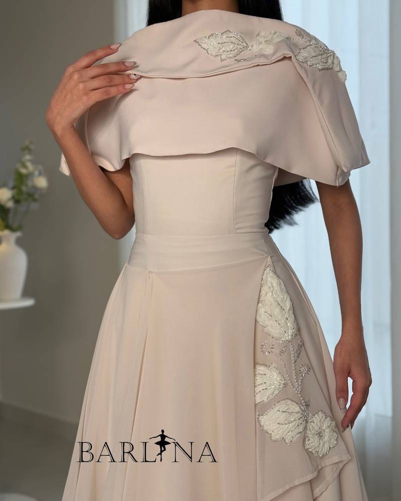 Light beige dress with an asymmetrical hem