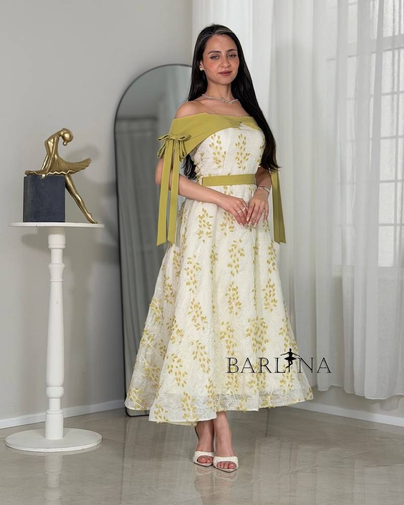 Off-white dress with olive-green floral patterns
