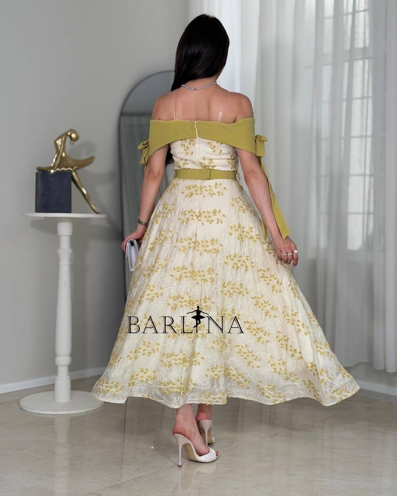 Off-white dress with olive-green floral patterns