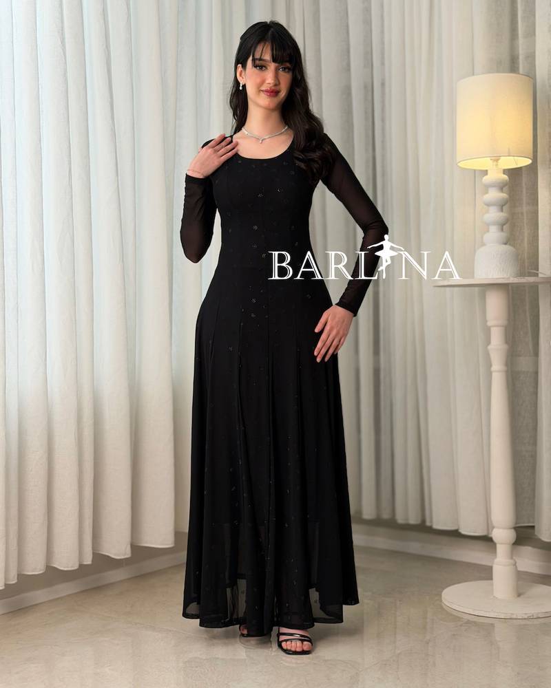 A long, elegant, sophisticated, and feminine black dress
