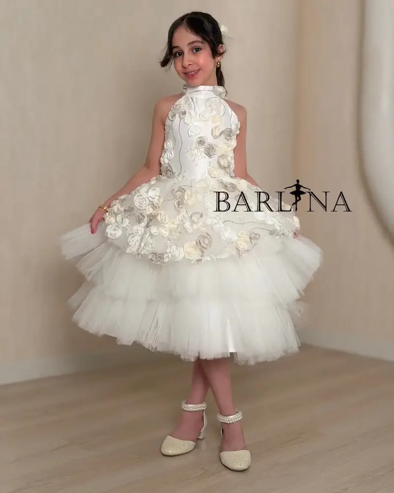 White girl's dress with prominent roses and fluffy tulle