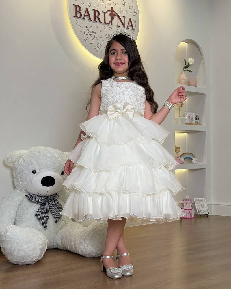 Girls' dress with puffy cream-colored layers