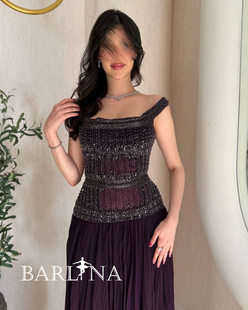 Elegant purple dress with heavy embroidery on the top