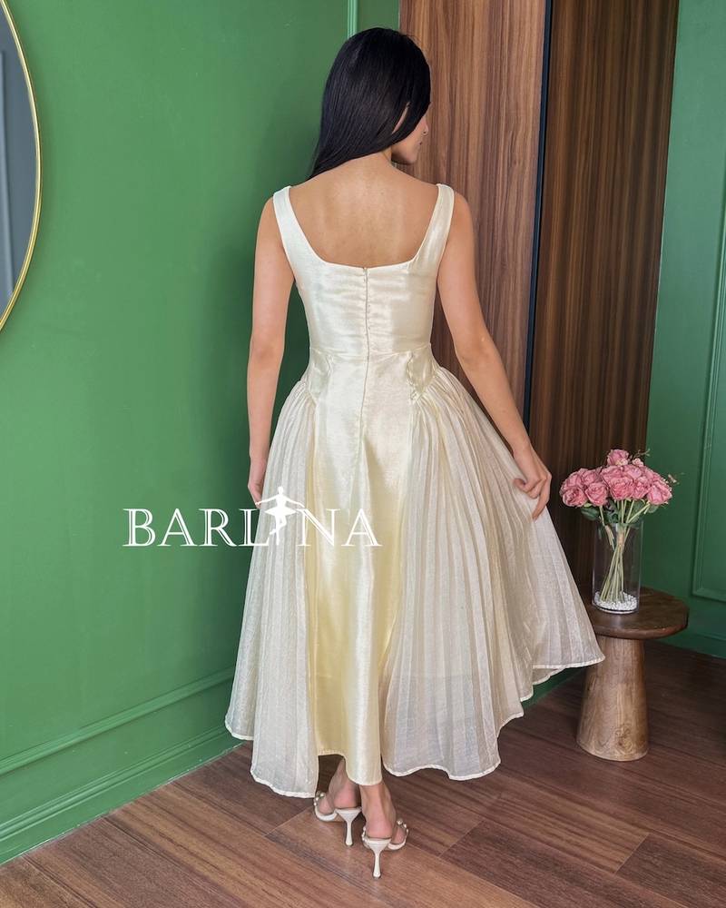Soft beige shiny midi dress with soft pleats