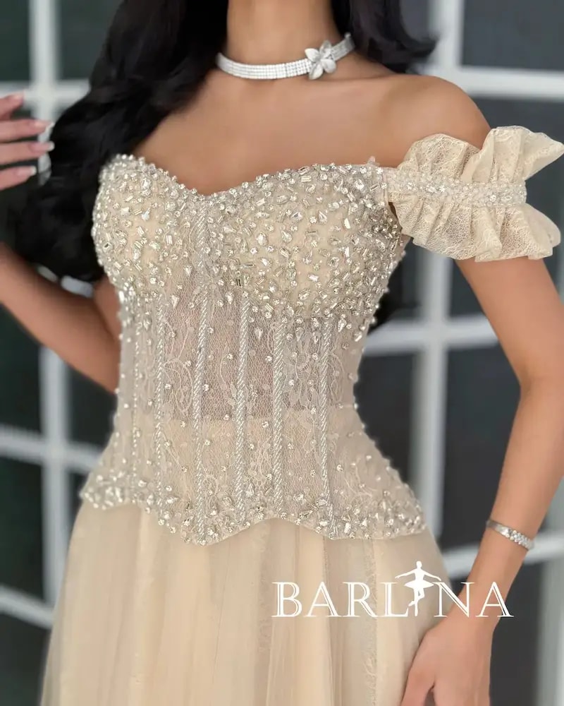 Beige evening dress with a corset cut and beaded embellishments
