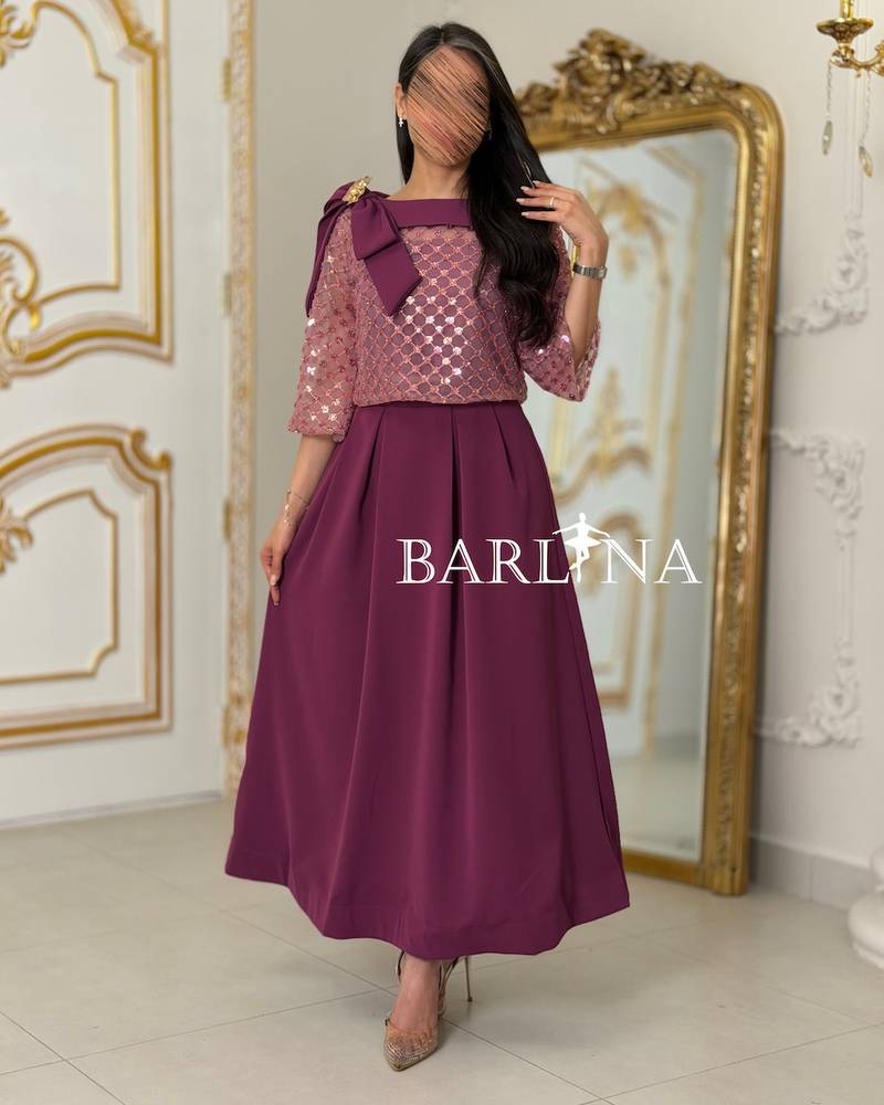 Soft fuchsia embroidered set adorned with a bow