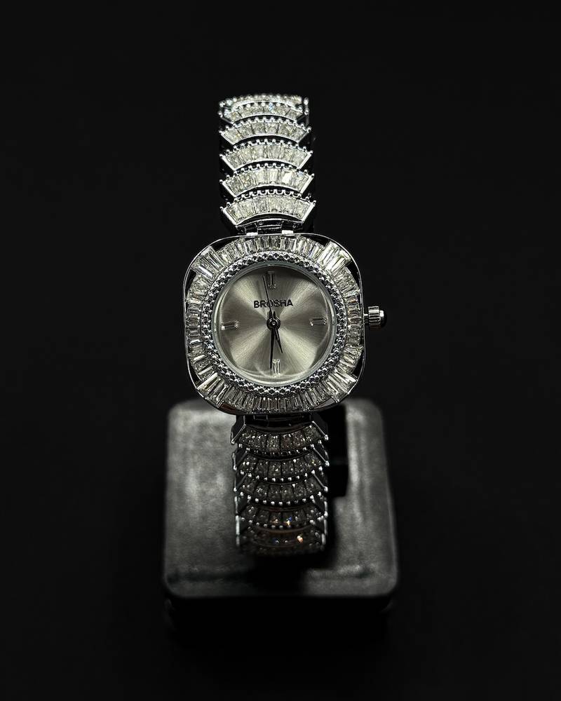 watch with a rounded square frame adorned with crystals