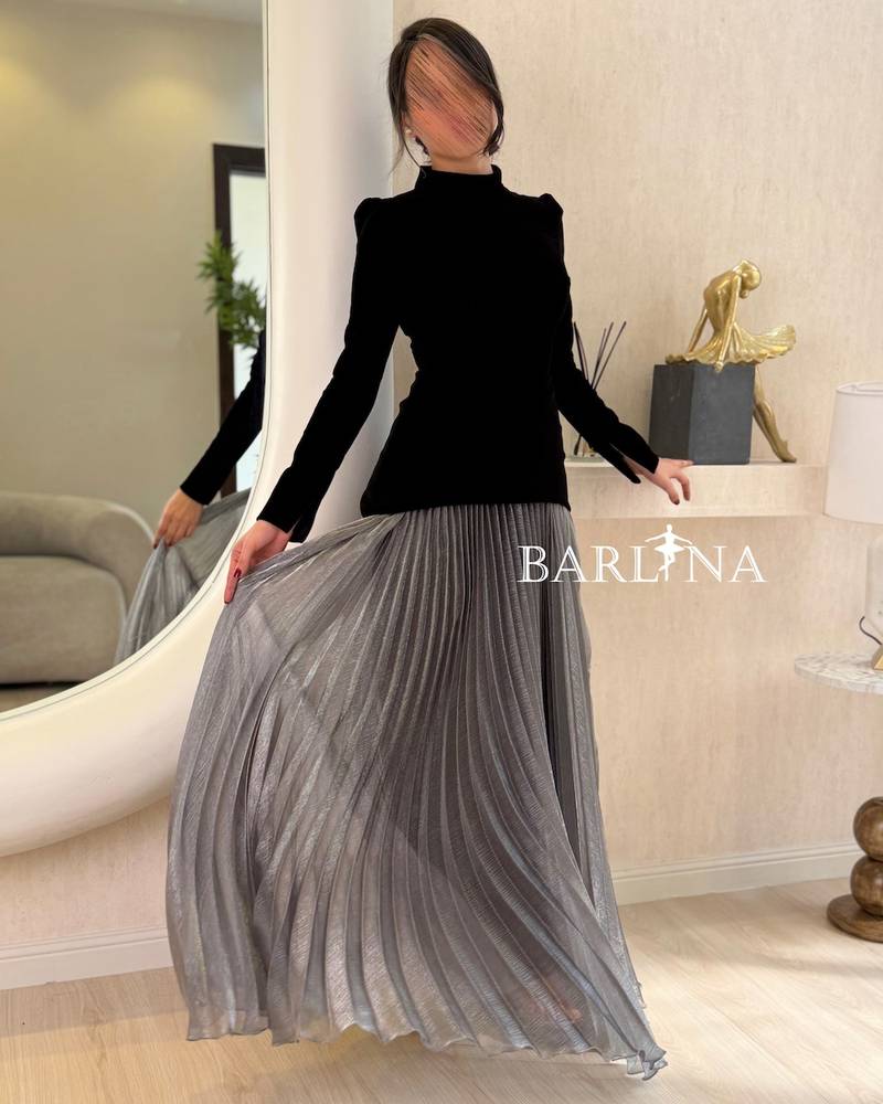 Black velvet dress with long silver pleats