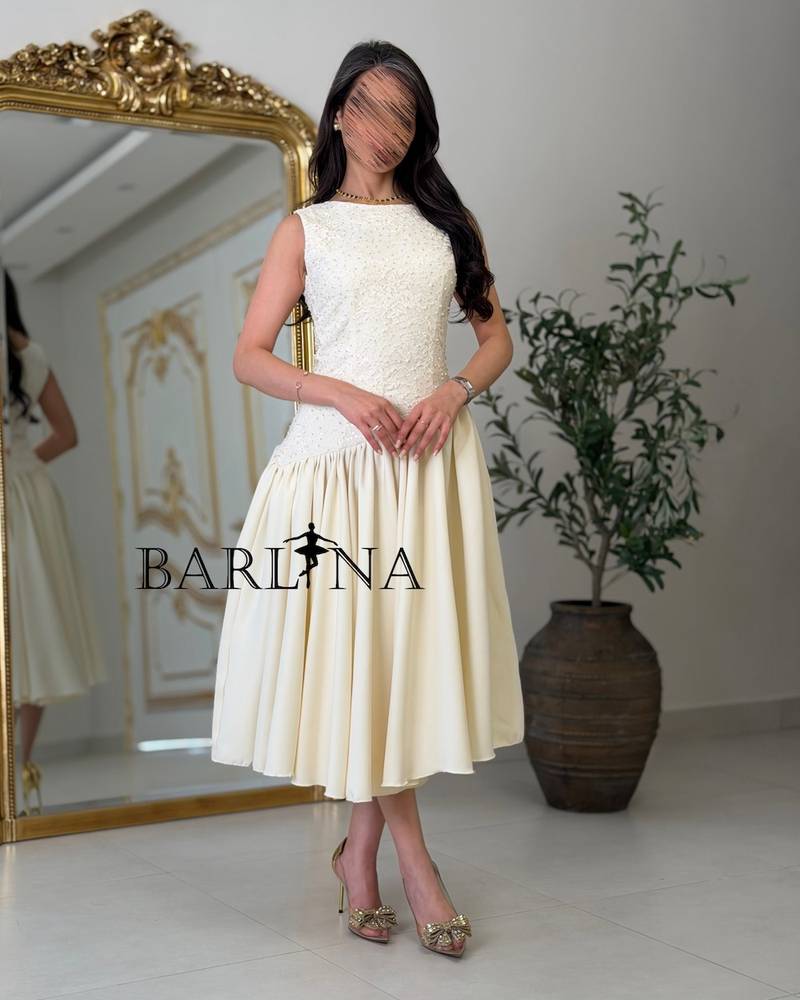 Soft midi dress with a sequined bodice