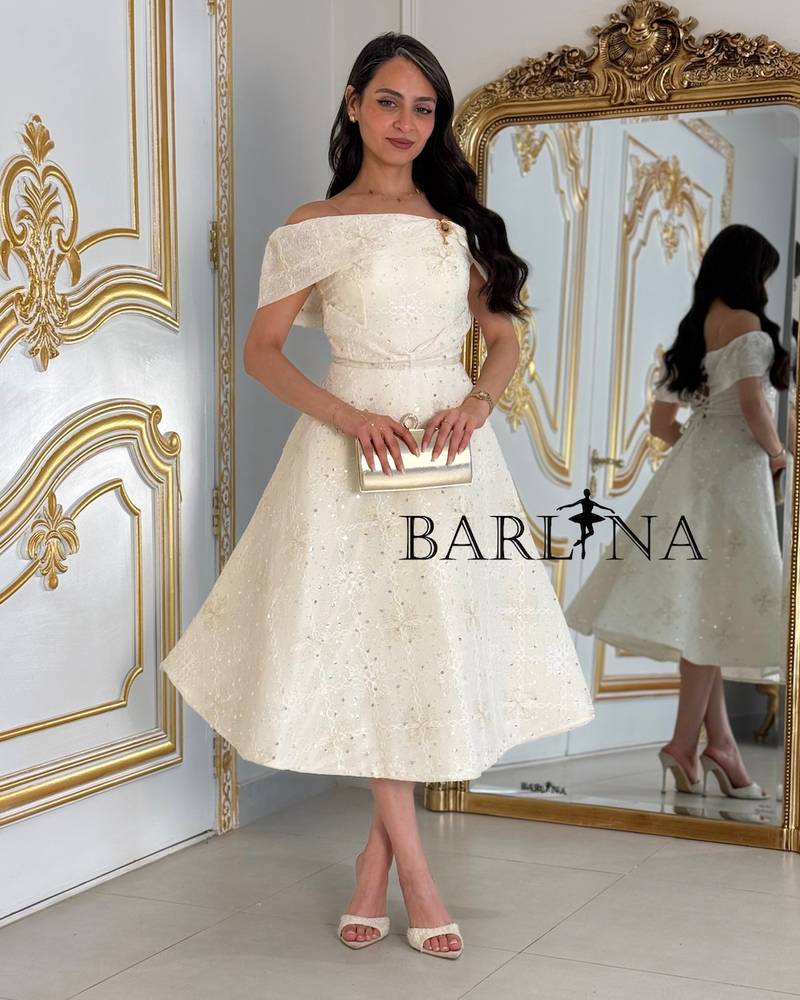 Off-white midi dress with a subtle sheen