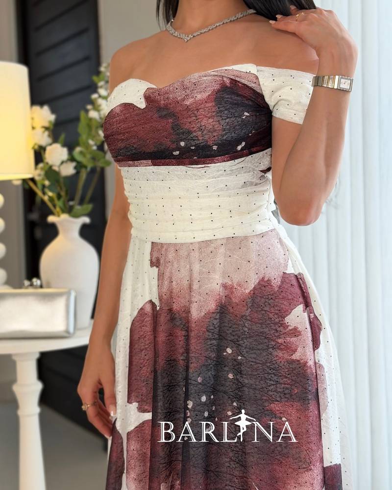 Off-white dress with a purple floral print