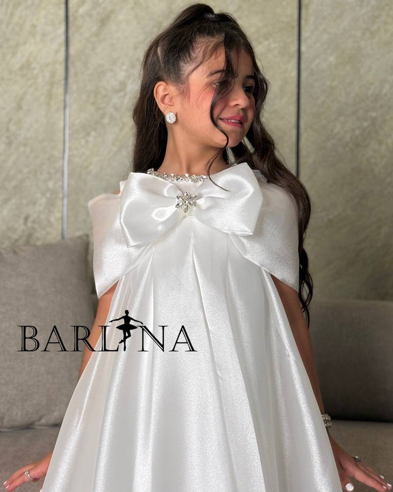 Girls' white dress with a back train design
