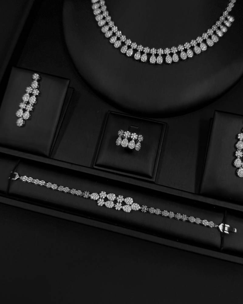 Elegant accessory set with a repeating, draped design