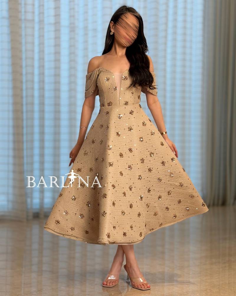 Beige midi dress embellished with gold sequins