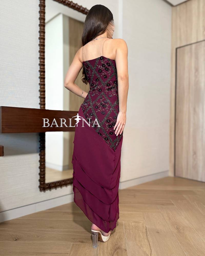 Burgundy dress with soft layers and an asymmetrical hem