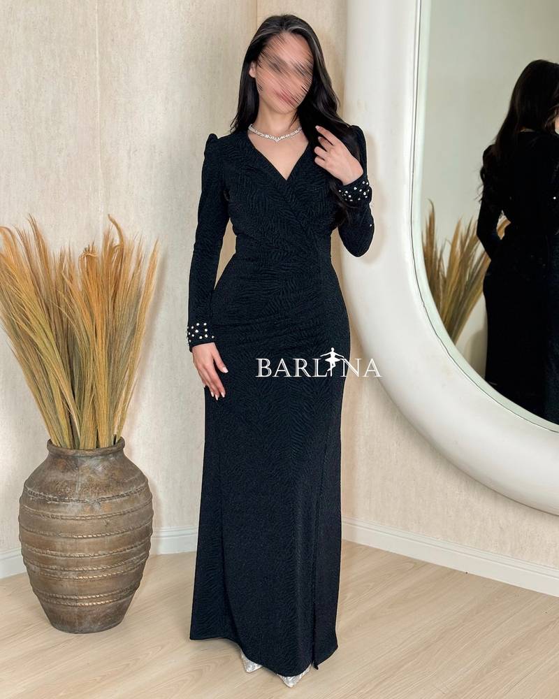 Dark green draped dress with patterned fabric